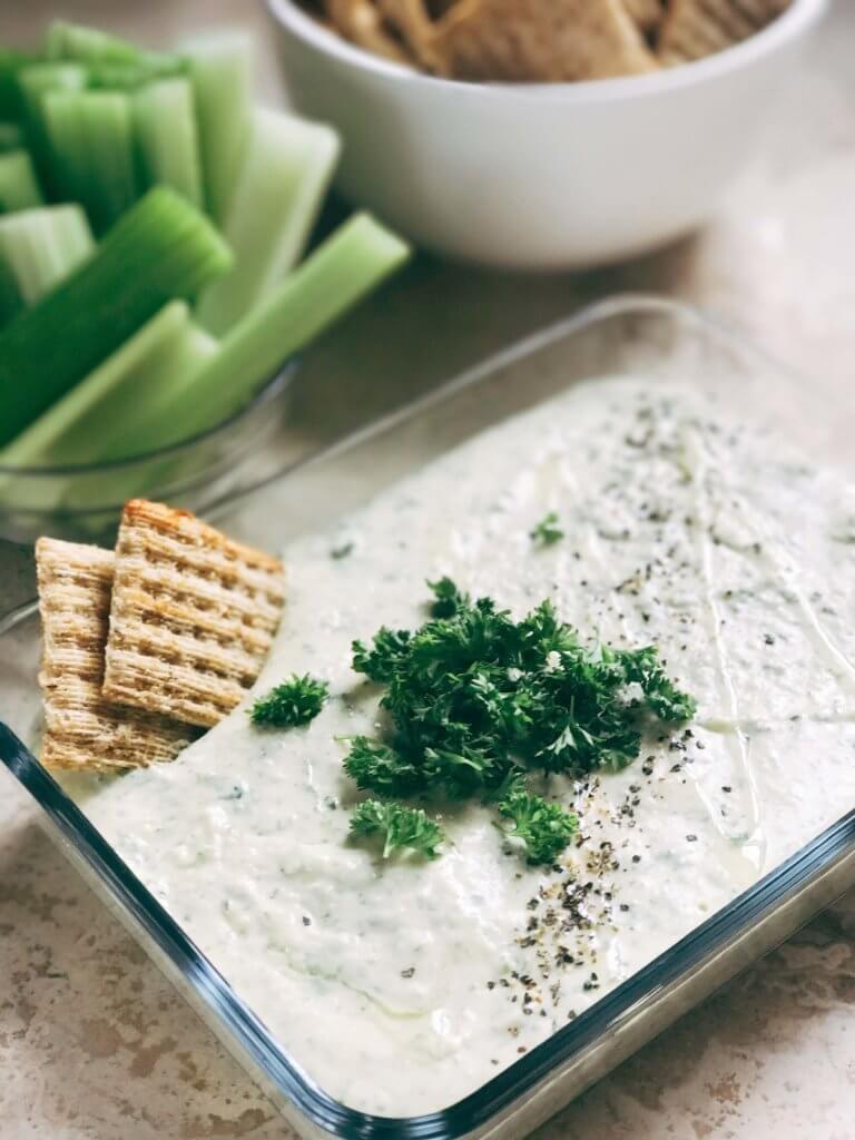 Ready in 5 minutes, this hummus is perfect as a snack, dip, appetizer, or spread. Classic flavors make this fast and simple treat a healthier way to enjoy ranch. Easy and quick to make, vegetarian, kid friendly. Parsley, Greek yogurt, garbanzo beans, lemon, and more! Ranch Hummus | Three Olives Branch | www.threeolivesbranch.com