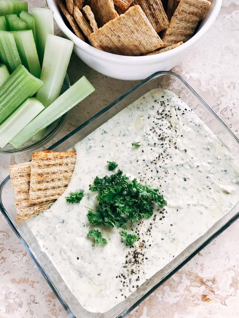 Ready in 5 minutes, this hummus is perfect as a snack, dip, appetizer, or spread. Classic flavors make this fast and simple treat a healthier way to enjoy ranch. Easy and quick to make, vegetarian, kid friendly. Parsley, Greek yogurt, garbanzo beans, lemon, and more! Ranch Hummus | Three Olives Branch | www.threeolivesbranch.com