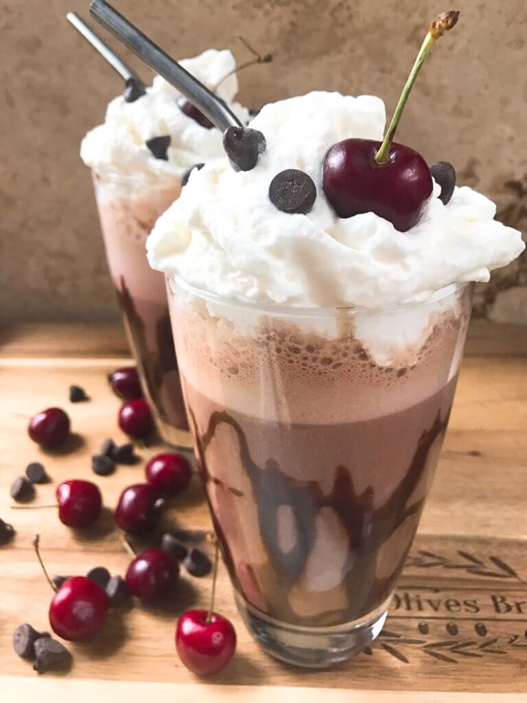 A perfect coffee drink for the summer and warm weather! Ready in just minutes, this frozen coffee can also be made as an iced coffee. Classic Black Forest dessert flavors of cream, cherries, and chocolate are paired with coffee for a fun treat. Simple and easy to make, vegetarian. Frozen Black Forest Mocha Coffee | Three Olives Branch | www.threeolivesbranch.com