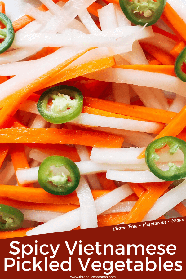 Simple and easy Spicy Vietnamese Pickled Vegetables perfect for your banh mi! Use as a quick condiment on your favorite foods. Quick refrigerator pickle of daikon radish and carrots are made spicy with serrano. A rice vinegar base is ready in just minutes for this classic Vietnamese slaw. Use cucumber or your favorite vegetables. Vegan, gluten free, and vegetarian. #pickled #banhmi #vietnamese