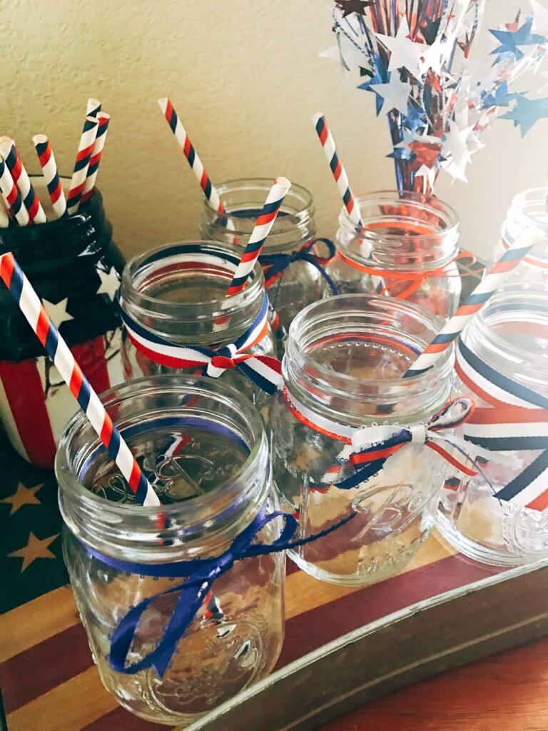 Patriotic Mason Jars for Drinks Station - Simple ideas and tips for Hosting a Patriotic Party including the menu we served! Chicken and Vegetarian Banh Mi Burgers featuring sweet chili sauce, Vietnamese Pickled Vegetable Rice Noodle Salad, BLT Panzanella, and Raspberry Rose (Frose) Popsicles. A perfect summer BBQ or grilling dinner party theme to celebrate the USA and American heritage. Hosting a Patriotic Party | Three Olives Branch | www.threeolivesbranch.com
