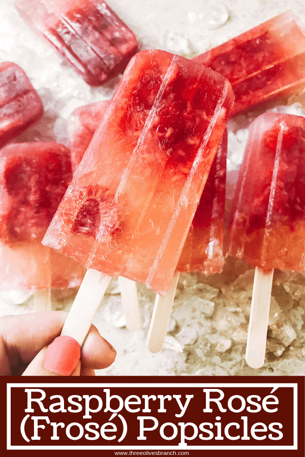 Popsicles made of rosé wine and raspberries! Simple to make and a great alcoholic adult treat for the warm and hot summer days. A twist on the frosé (frozé) trend, putting your favorite pink rose wine in popsicle form. A perfect treat or poptail for a cookout, barbecue, or grilling day. BBQ parties never tasted so good! Cocktail on a stick. Raspberry Rosé (Frosé) Popsicles #popsicles #poptails #boozypopsicles #rosewine