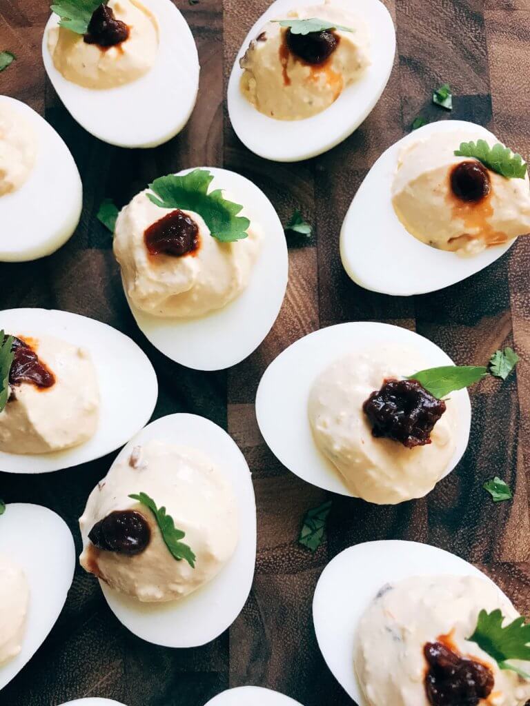 Ready in less than 10 minutes, this deviled egg recipe is a fun twist on a classic appetizer. Chipotle peppers in adobo and lime juice give Mexican food flare to the deviled egg. Simple, fast, and easy to make. Vegetarian and gluten free. A great party snack for game day or holiday events and party gatherings. Chipotle Lime Deviled Eggs | Three Olives Branch | www.threeolivesbranch.com