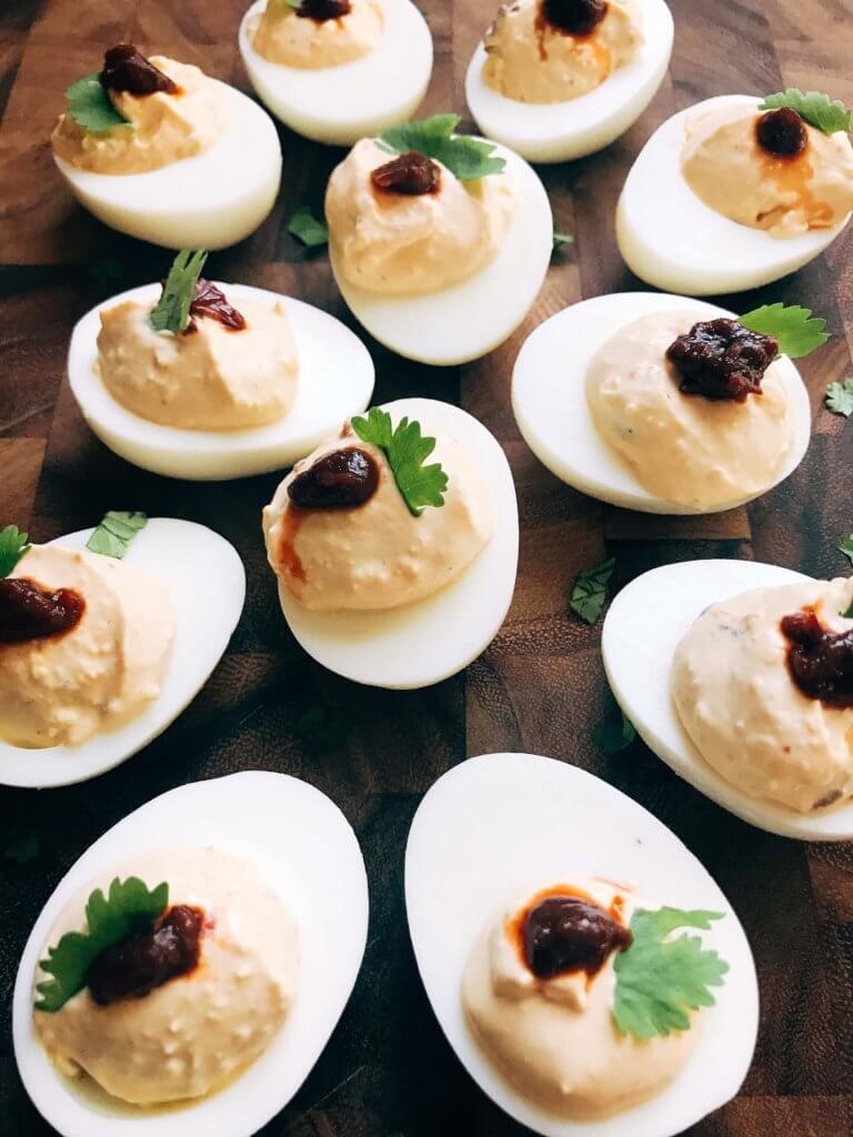 Ready in less than 10 minutes, this deviled egg recipe is a fun twist on a classic appetizer. Chipotle peppers in adobo and lime juice give Mexican food flare to the deviled egg. Simple, fast, and easy to make. Vegetarian and gluten free. A great party snack for game day or holiday events and party gatherings. Chipotle Lime Deviled Eggs | Three Olives Branch | www.threeolivesbranch.com