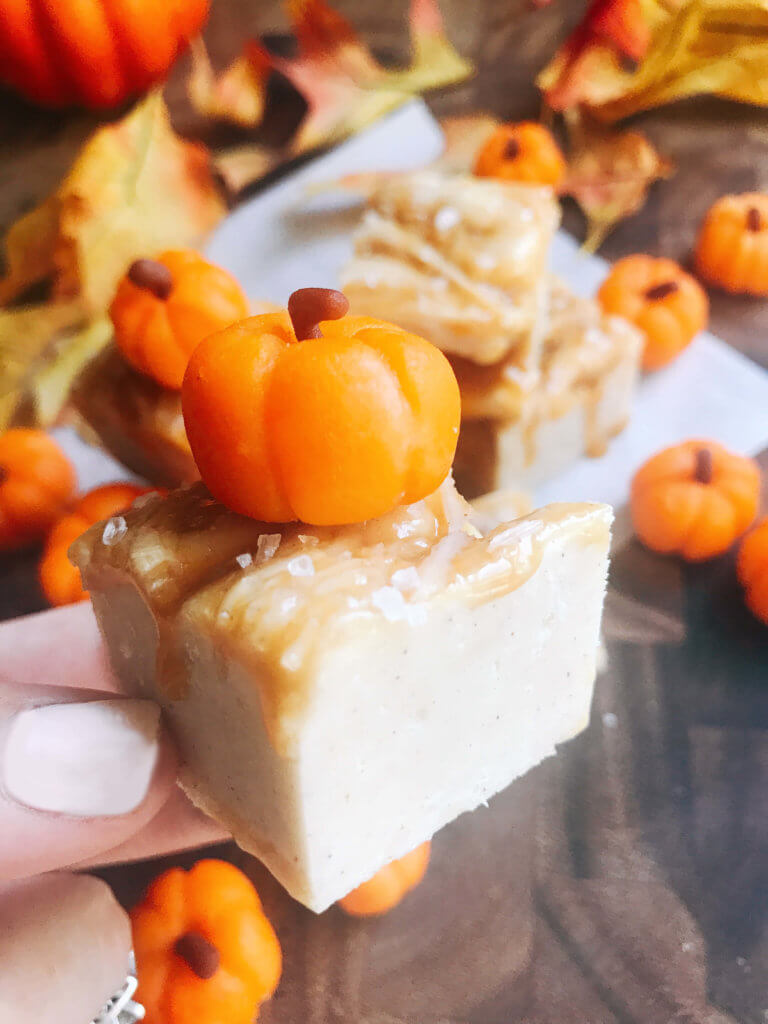 White chocolate fudge with no marshmallow. A seasonal treat for fall/autumn, Halloween, and Thanksgiving. This simple and easy fudge is flavored with pumpkin spice and topped with salted caramel. Microwave fudge. Vegetarian, gluten free GF. Fall comfort food in a simple dessert. Salted Caramel Pumpkin Spice Fudge | Three Olives Branch | www.threeolivesbranch.com