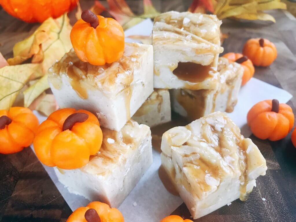 White chocolate fudge with no marshmallow. A seasonal treat for fall/autumn, Halloween, and Thanksgiving. This simple and easy fudge recipe is flavored with pumpkin spice and topped with salted caramel. Microwave fudge. Vegetarian, gluten free GF. Fall comfort food in a simple dessert. Salted Caramel Pumpkin Spice Fudge | Three Olives Branch | www.threeolivesbranch.com