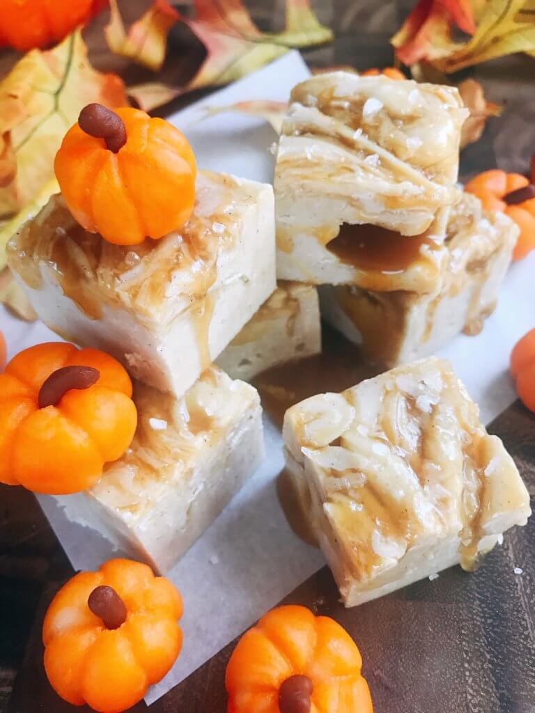 White chocolate fudge with no marshmallow. A seasonal treat for fall/autumn, Halloween, and Thanksgiving. This simple and easy fudge is flavored with pumpkin spice and topped with salted caramel. Microwave fudge. Vegetarian, gluten free GF. Fall comfort food in a simple dessert. Salted Caramel Pumpkin Spice Fudge | Three Olives Branch | www.threeolivesbranch.com