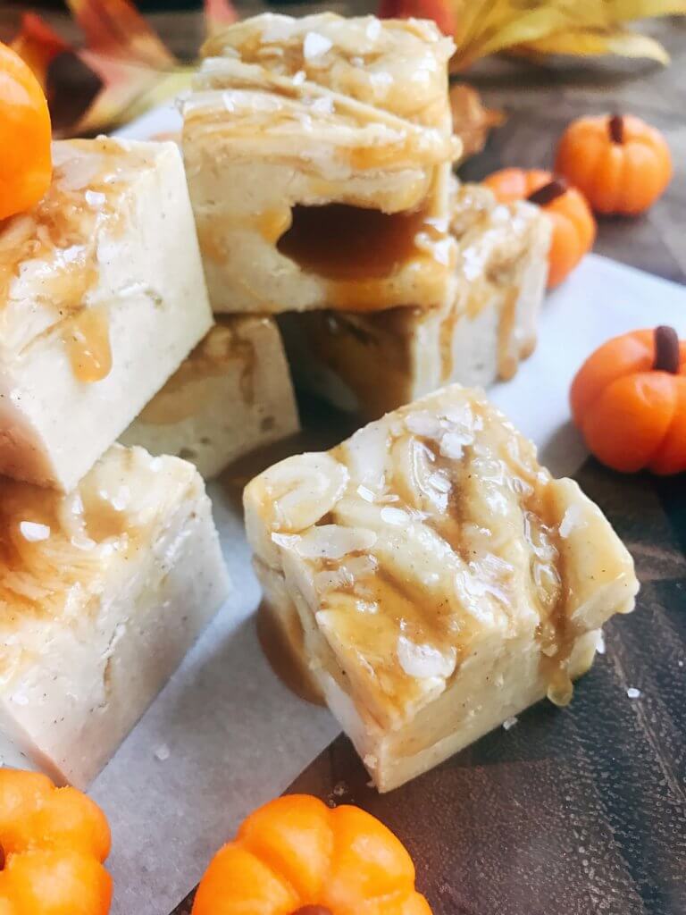 White chocolate fudge with no marshmallow. A seasonal treat for fall/autumn, Halloween, and Thanksgiving. This simple and easy fudge is flavored with pumpkin spice and topped with salted caramel. Microwave fudge. Vegetarian, gluten free GF. Fall comfort food in a simple dessert. Salted Caramel Pumpkin Spice Fudge | Three Olives Branch | www.threeolivesbranch.com