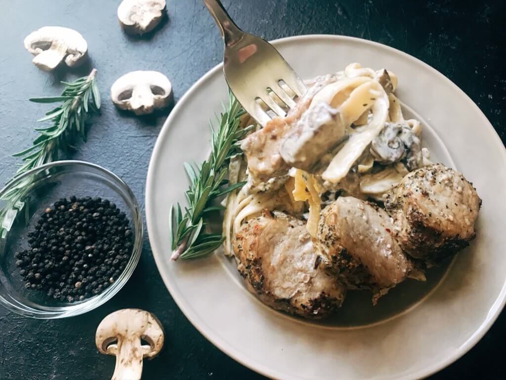 25 minutes to makes these marinated pork medallions and creamy mushroom pasta. Smithfield Roasted Garlic and Cracked Peppercorn Tenderloin Marinated Pork is a quick and easy meal solution for busy families any night of the week. The pasta is made from cream, mushrooms, garlic, and cracked black pepper. Fast, simple, and easy comfort food. Pork Medallions with Creamy Peppercorn Mushroom Pasta | Three Olives Branch | www.threeolivesbranch.com