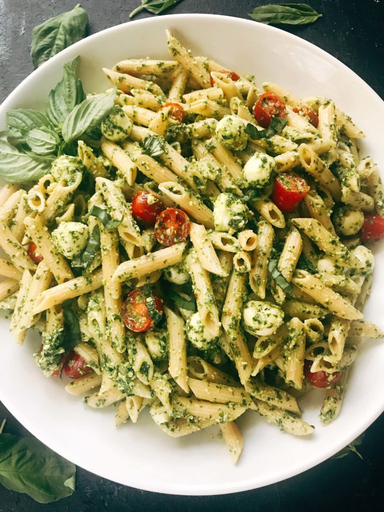 Less than 25 minutes to make this fresh basil pesto pasta with cherry tomatoes and fresh mozzarella cheese. A quick and simple Italian pasta recipe highlighting fresh caprese flavors. Vegetarian recipe but add chicken or sausage for the meat lovers. Featuring Barilla ProteinPLUS pasta, this dinner recipe is nutritious and hearty, packed with protein, fiber, and Omega-3. Pesto Caprese Penne Pasta | Three Olives Branch | www.threeolivesbranch.com