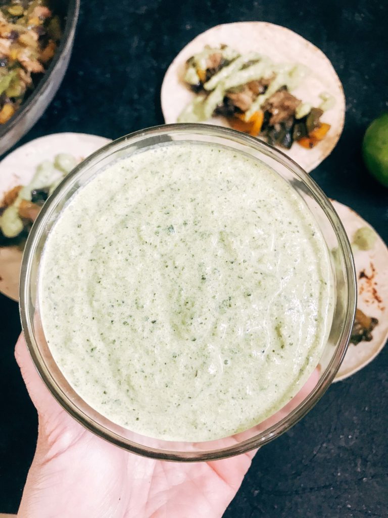 Quick and simple crema recipe for Mexican foods. Roasted poblano peppers are blended with lime juice and sour cream for a fast and easy sauce. Vegetarian, low carb keto, and gluten free recipe. Roasted Poblano Lime Crema #poblanosauce #tacosauce #mexicansauce