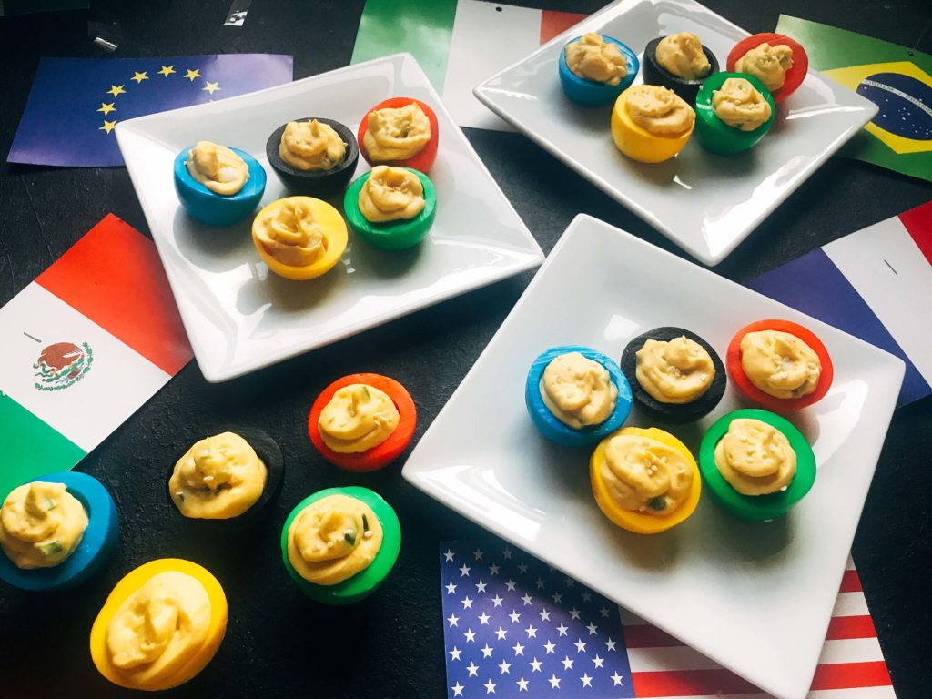 Korean flavored deviled eggs in time for the 2018 Winter Olympics! This deviled egg recipe is fast, easy, and simple to make. Korean flavors of chile pepper, soy, and sesame in honor of the host city. Vegetarian and gluten free. Korean Olympic Ring Deviled Eggs | Three Olives Branch | www.threeolivesbranch.com #olympicrecipe #glutenfree #olympicrings