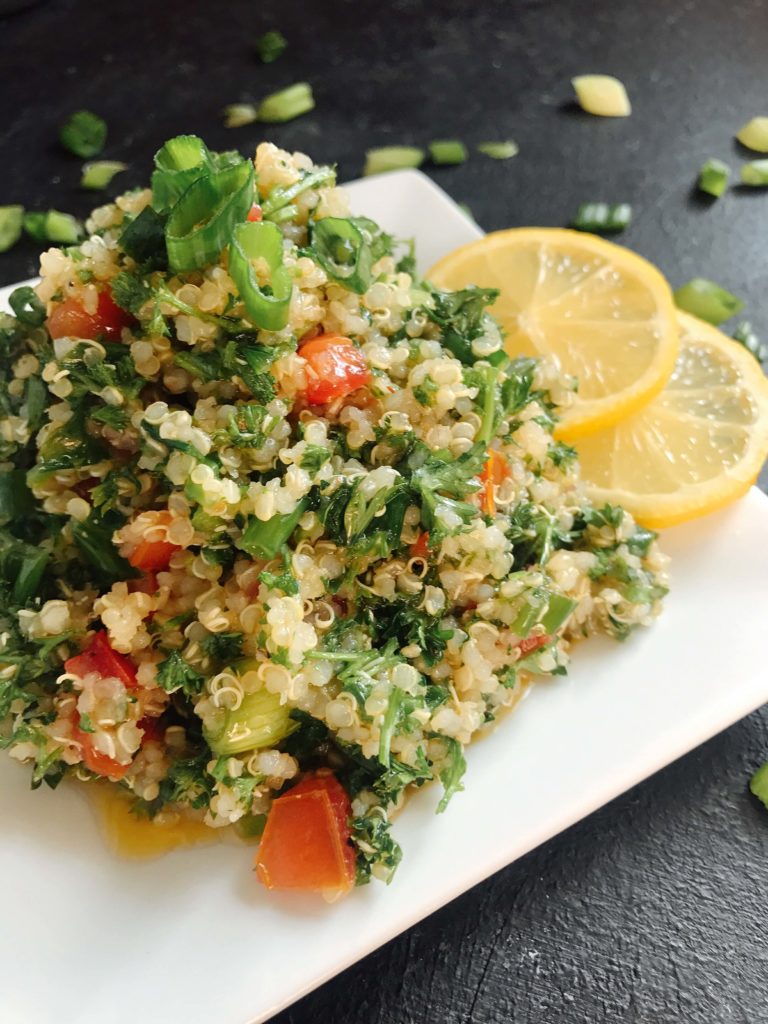 Ready in 15-20 minutes, this tabbouleh is perfect as a side or lunch. Fresh parsley, green onion, tomatoes, lemon, and mint are mixed with quinoa for a twist on classic tabouleh (tabouli). Vegan, vegetarian, gluten free. Vegan Quinoa Tabbouleh | Three Olives Branch | www.threeolivesbranch.com #vegan #tabbouleh #healthy