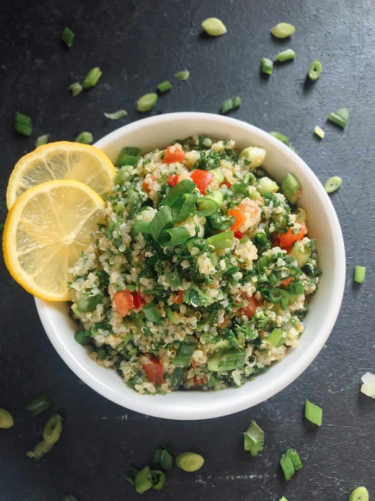 Ready in 15-20 minutes, this tabbouleh is perfect as a side or lunch. Fresh parsley, green onion, tomatoes, lemon, and mint are mixed with quinoa for a twist on classic tabouleh (tabouli). Vegan, vegetarian, gluten free. Vegan Quinoa Tabbouleh | Three Olives Branch | www.threeolivesbranch.com #vegan #tabbouleh #healthy