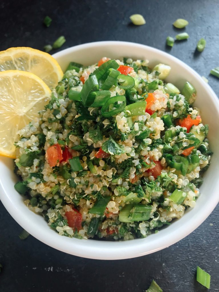 Ready in 15-20 minutes, this tabbouleh is perfect as a side or lunch. Fresh parsley, green onion, tomatoes, lemon, and mint are mixed with quinoa for a twist on classic tabouleh (tabouli). Vegan, vegetarian, gluten free. Vegan Quinoa Tabbouleh | Three Olives Branch | www.threeolivesbranch.com #vegan #tabbouleh #healthy