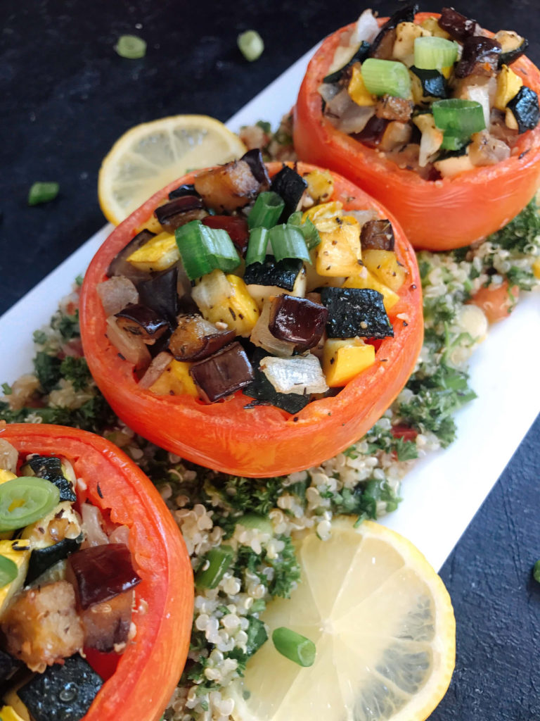 Eggplant, zucchini, and yellow squash stuffed in tomatoes for a twist on classic ratatouille. A healthy recipe that is vegan, vegetarian, low carb keto, gluten free (gf), whole 30, and paleo. Vegan Quinoa Tabbouleh | Three Olives Branch | www.threeolivesbranch.com #vegan #healthyrecipe