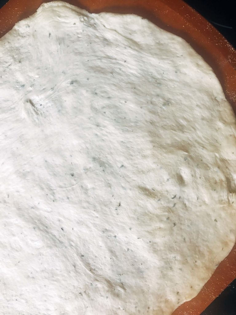 Homemade pizza dough made with Ranch seasoning for a flavorful pizza crust. A great pizza crust base for unique pizza recipes like buffalo chicken pizza or buffalo cauliflower pizza for game day or the Super Bowl. Vegetarian. Ranch Pizza Crust | Three Olives Branch | www.threeolivesbranch.com #gameday #superbowl #pizzadough #pizzacrust 