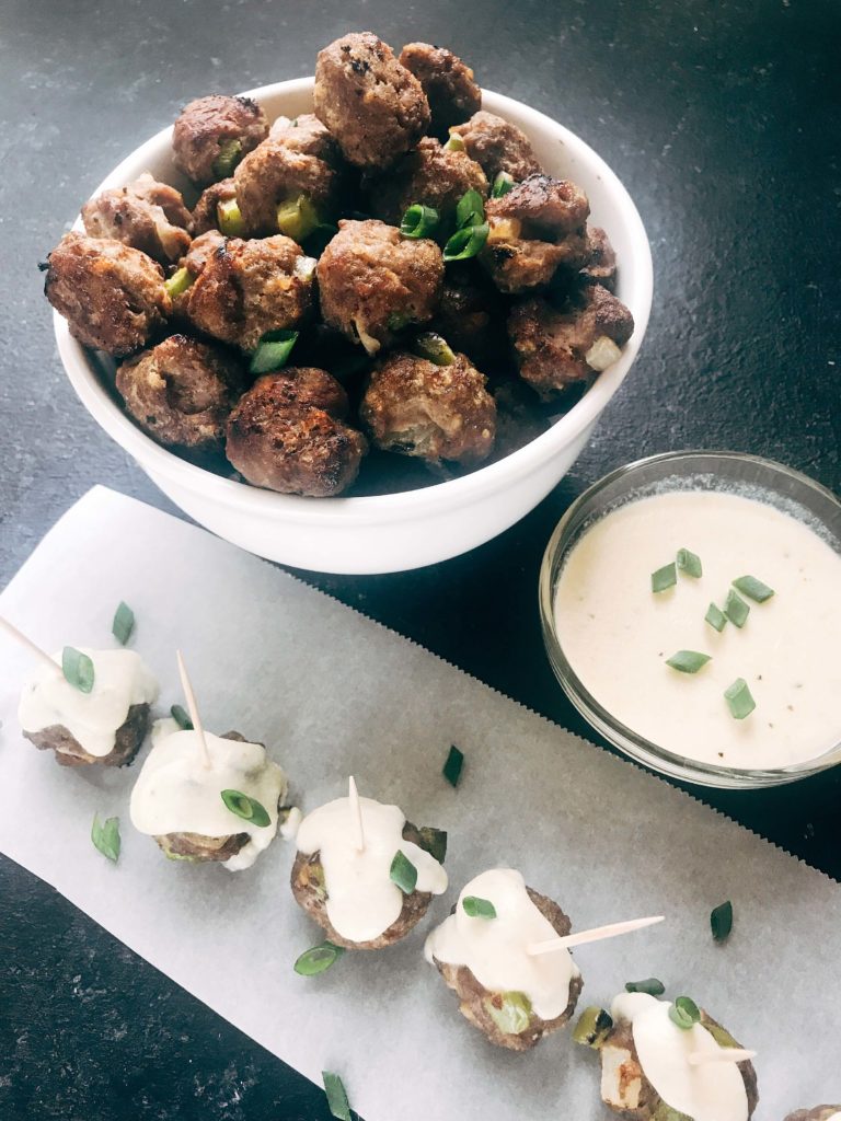 Beef meatballs mixed with green bell pepper and onion, served with a provolone cheese dipping sauce. Traditional Philly Cheesesteak flavors in meatball form. Perfect for game day, especially rooting for the Philadelphia Eagles, and the Super Bowl. Simple to make. Philly Cheesesteak Meatballs | Three Olives Branch | www.threeolivesbranch.com #superbowl #appetizer #meatball #gameday #football