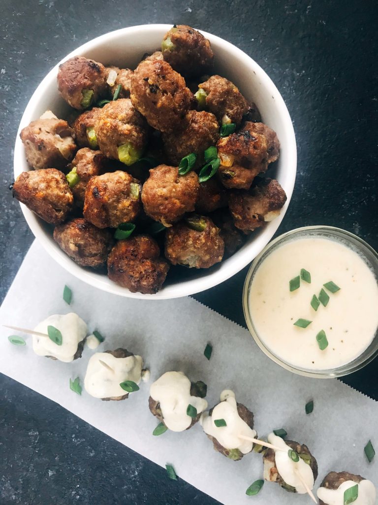 Beef meatballs mixed with green bell pepper and onion, served with a provolone cheese dipping sauce. Traditional Philly Cheesesteak flavors in meatball form. Perfect for game day, especially rooting for the Philadelphia Eagles, and the Super Bowl. Simple to make. Philly Cheesesteak Meatballs | Three Olives Branch | www.threeolivesbranch.com #superbowl #appetizer #meatball #gameday #football