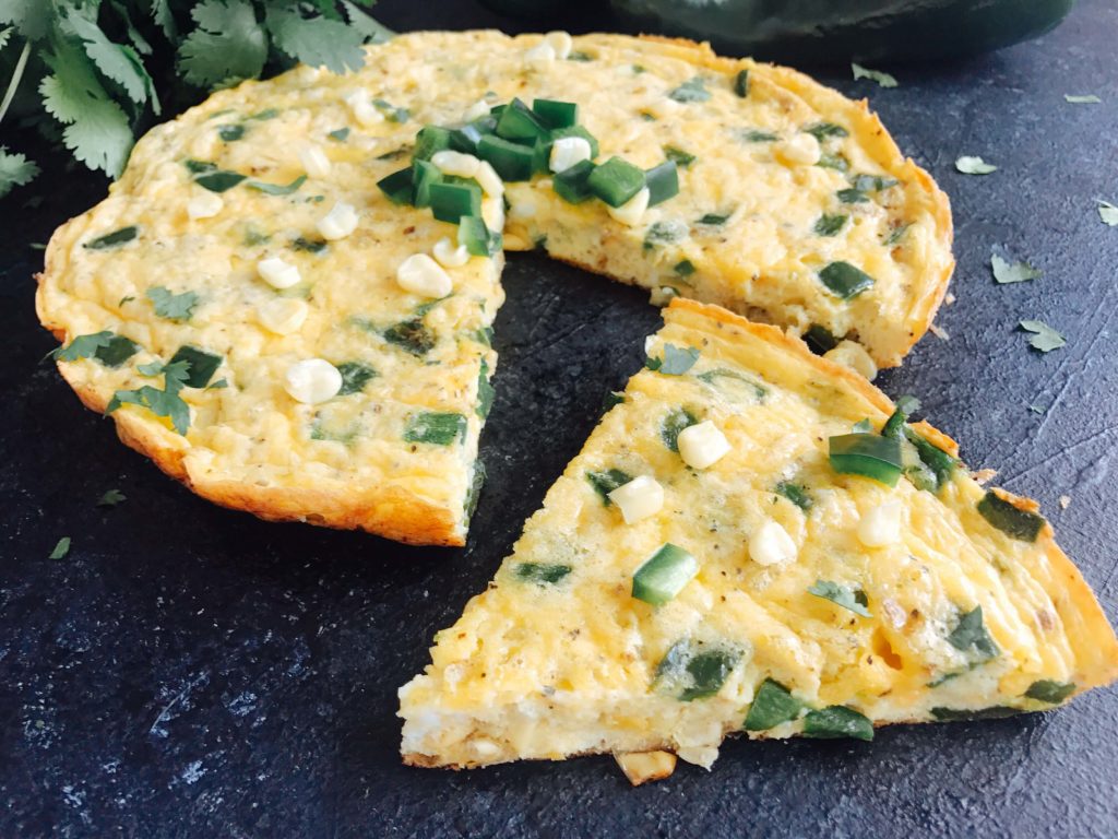 A quick and simple breakfast recipe, this frittata is full of poblano pepper and corn. Vegetarian and gluten free (GF). Easy brunch for a crowd with Mexican flavors. Poblano, Corn, and Cheddar Frittata | Three Olives Branch | www.threeolivesbranch.com #mexicanbreakfast #mexicanbrunch #easybreakfast #fastbreakfast #glutenfree