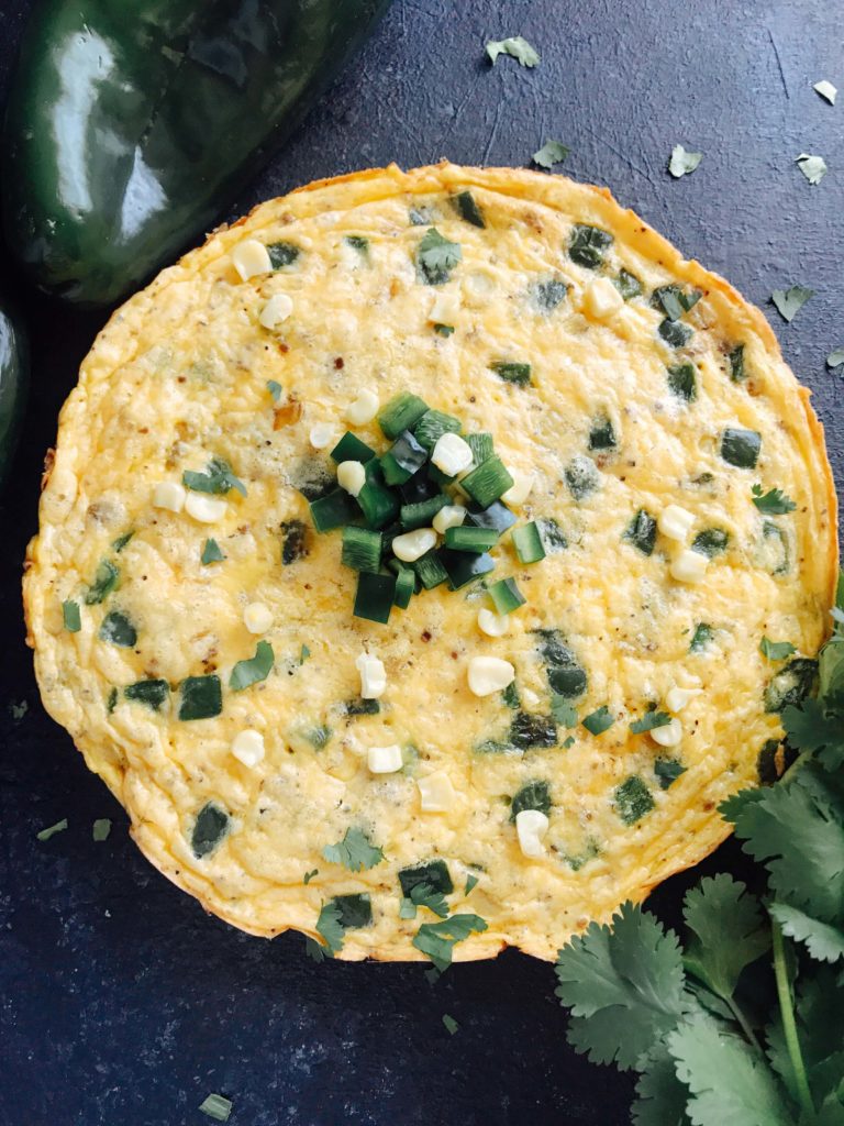 A quick and simple breakfast recipe, this frittata is full of poblano pepper and corn. Vegetarian and gluten free (GF). Easy brunch for a crowd with Mexican flavors. Poblano, Corn, and Cheddar Frittata | Three Olives Branch | www.threeolivesbranch.com #mexicanbreakfast #mexicanbrunch #easybreakfast #fastbreakfast #glutenfree
