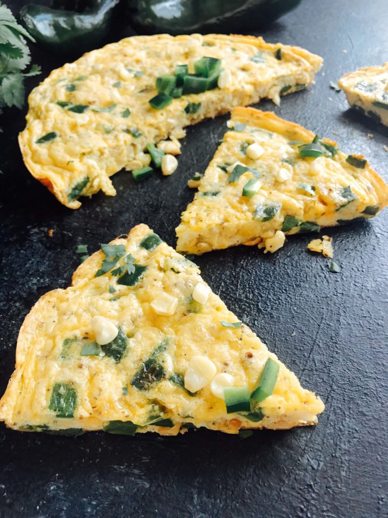 A quick and simple breakfast recipe, this frittata is full of poblano pepper and corn. Vegetarian and gluten free (GF). Easy brunch for a crowd with Mexican flavors. Poblano, Corn, and Cheddar Frittata | Three Olives Branch | www.threeolivesbranch.com #mexicanbreakfast #mexicanbrunch #easybreakfast #fastbreakfast #glutenfree