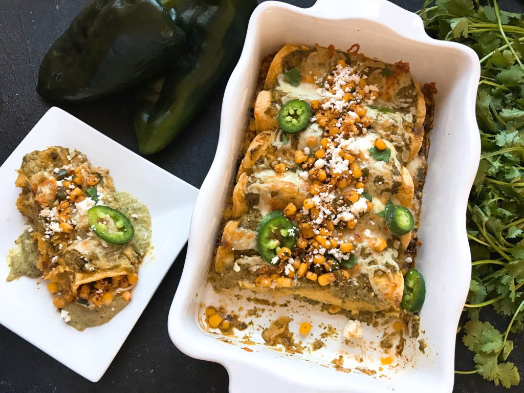 Corn, jalapeno peppers, cilantro, lime, chili powder, and cotija cheese are combined to make a Mexican Street Corn (elote) salsa that is the star of these enchiladas.. Layered with Monterey Jack cheese and topped with Roasted Poblano and Lime Enchilada Sauce. Vegetarian. Mexican Street Corn Enchiladas | Three Olives Branch | www.threeolivesbranch.com #vegetarian #mexican #enchiladas