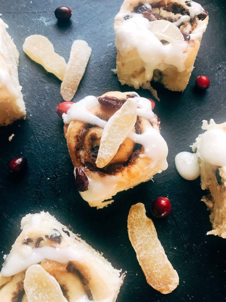 Homemade cinnamon rolls flavored with ginger and cranberry. Make them the day before for a quick and easy breakfast or brunch. Crystallized ginger (candied ginger) and dried cranberries are in the cinnamon filling, with ground ginger and cranberries in the dough. Perfect for the holiday season, Christmas or Thanksgiving, but so good I will make them all year! Vegetarian recipe. Cranberry Ginger Cinnamon Rolls | Three Olives Branch | www.threeolivesbranch.com #cinnamonrolls #holidaybreakfast #cranberryginger