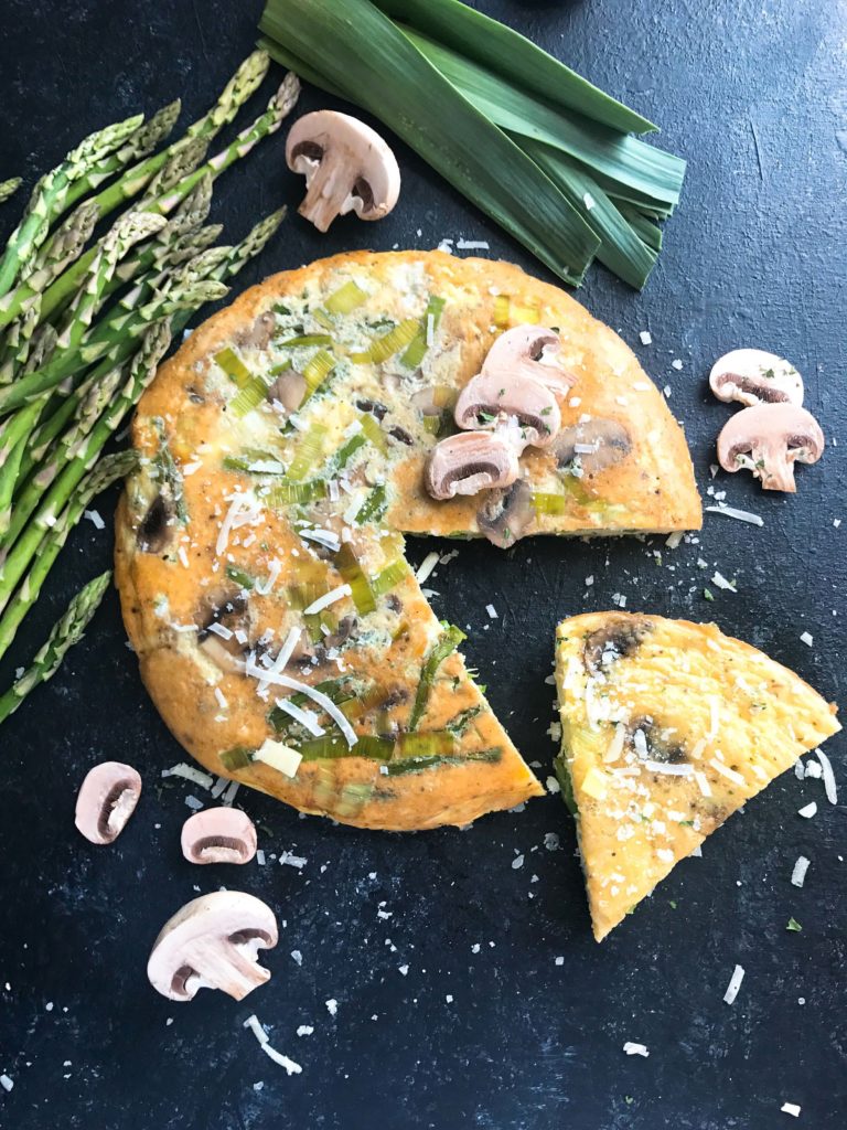 A quick and simple breakfast or brunch recipe ready in 20 minutes. Vegetarian, low carb keto, and gluten free, this frittata is similar to an omelette and perfect for holidays like Easter and feeding a crowd. Asparagus, Leek, and Mushroom Parmesan Frittata #breakfastrecipe #vegetarianbreakfast #easterbrunch #springbreakfast