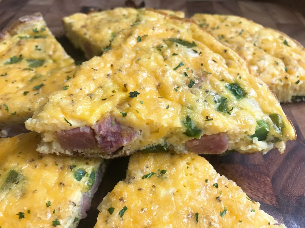 Quick and simple breakfast or brunch recipe, ready in less than 30 minutes. Ham, green bell pepper, onion, and cheddar highlight this twist on a Denver Omelette. Perfect to use up leftover ham from Easter, Christmas, or the holidays. Gluten free (gf). Denver Frittata | Three Olives Branch | www.threeolivesbranch.com