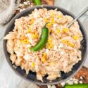 Mexican Street Corn Pasta Salad in a bowl with a spoon in it