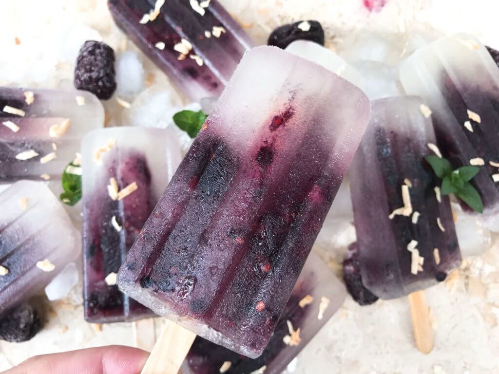 Quick and simple healthy popsicle recipe. Coconut water, blackberries and a little sugar (optional) for a fun and sweet kid friendly summer treat. Vegan, vegetarian, gluten free (GF) and can be paleo and Whole30 without the sugar. Blackberry Coconut Popsicles | Three Olives Branch | www.threeolivesbranch.com #popsicle