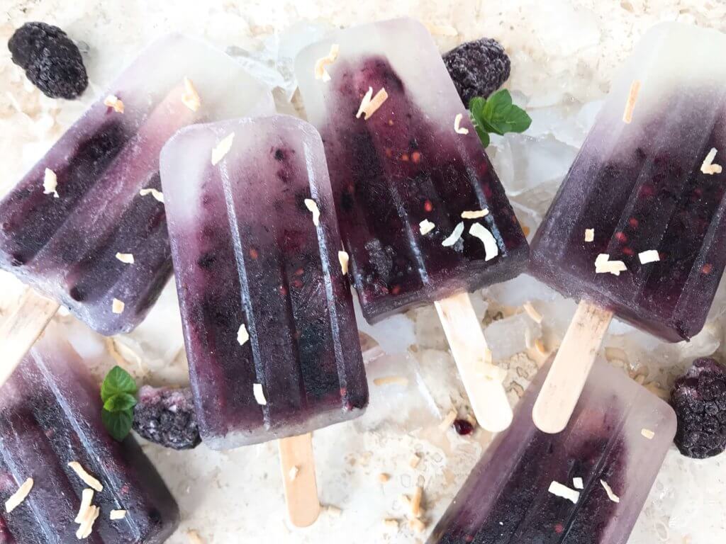 Quick and simple healthy popsicle recipe. Coconut water, blackberries and a little sugar (optional) for a fun and sweet kid friendly summer treat. Vegan, vegetarian, gluten free (GF) and can be paleo and Whole30 without the sugar. Blackberry Coconut Popsicles | Three Olives Branch | www.threeolivesbranch.com #popsicle