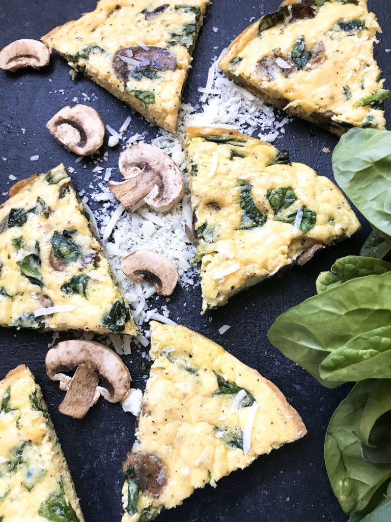 Ready in 20 minutes, a fast and simple breakfast or brunch recipe. Mushrooms, spinach, and cheese mixed in egg. Gluten free (gf). Vegetarian Spinach Florentine Frittata | Three Olives Branch | www.threeolivesbranch.com