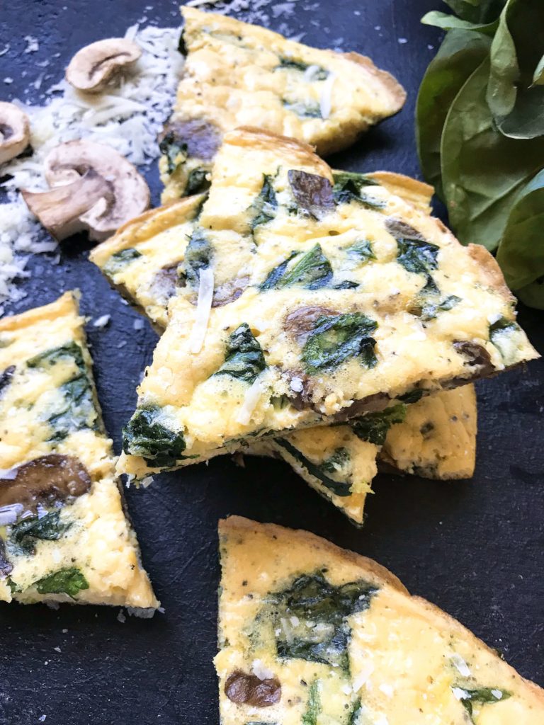 Ready in 20 minutes, a fast and simple breakfast or brunch recipe. Mushrooms, spinach, and cheese mixed in egg. Gluten free (gf). Vegetarian Spinach Florentine Frittata | Three Olives Branch | www.threeolivesbranch.com