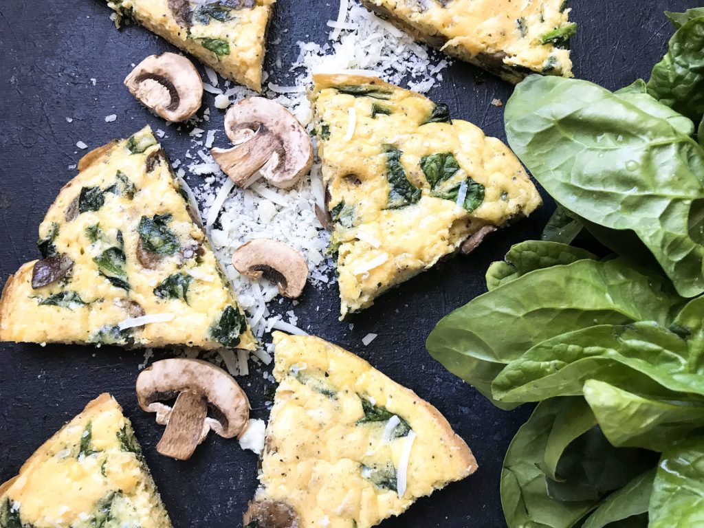 Ready in 20 minutes, a fast and simple breakfast or brunch recipe. Mushrooms, spinach, and cheese mixed in egg. Gluten free (gf). Vegetarian Spinach Florentine Frittata | Three Olives Branch | www.threeolivesbranch.com