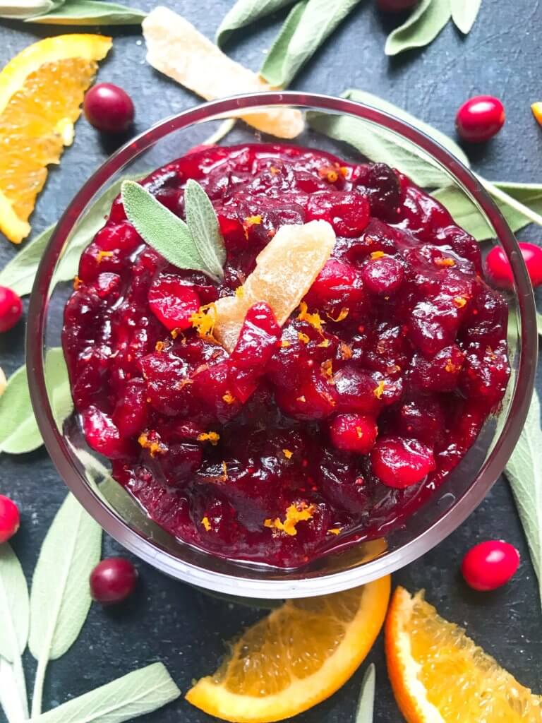 A quick and simple cranberry sauce recipe ready in 10 minutes. Flavored with ginger and orange, this sauce is vegetarian, vegan, and gluten free (GF). Perfect for Thanksgiving, Christmas, Easter, and holiday side dish. Make ahead! Ginger Orange Cranberry Sauce | Three Olives Branch | www.threeolivesbranch.com #thanksgiving #cranberrysauce #christmas