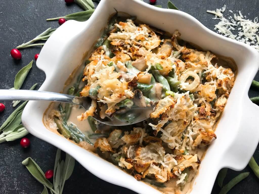 A twist on a classic holiday side dish. Parmesan and garlic enhance a homemade green bean casserole made from scratch. Make in advance for quick assembly on Christmas, Thanksgiving, Easter, or other holiday meals. Vegetarian. Parmesan Garlic Green Bean Casserole | Three Olives Branch | www.threeolivesbranch.com #thanksgivingrecipes #greenbeancasserole #holidayrecipes #christmasrecipes