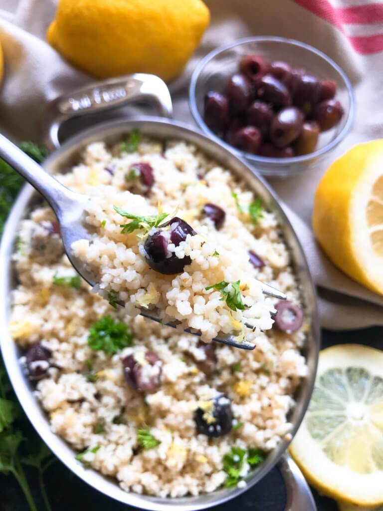 Ready in less than 10 minutes, this Vegan Mediterranean Lemon Olive Couscous recipe is full of fresh and bright flavors for a light side dish. Great with chicken, seafood, and vegetables. A simple and easy recipe to make. #fastrecipes #olives #lemon #sidedishrecipes