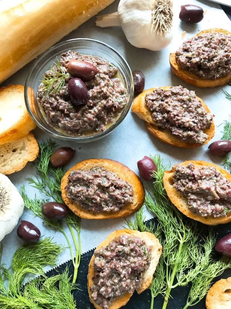 Ready in 5 minutes, this tapenade recipe is vegan, vegetarian, paleo, keto low carb, Whole 30, and gluten free (GF). Perfect as a holiday appetizer for Christmas, Thanksgiving, Easter, and more. Serve with crostini, chicken, pasta, vegetables, and more. Vegan Artichoke Olive Tapenade #holidayappetizer #olive #veganrecipe