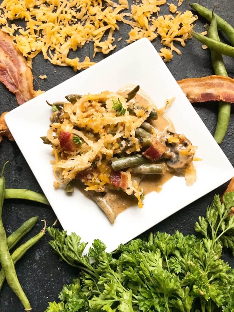 A twist on a classic holiday side dish. Bacon and cheddar cheese enhance a homemade green bean casserole made from scratch. Make in advance for quick assembly on Christmas, Thanksgiving, Easter, or other holiday meals. Bacon Cheddar Green Bean Casserole #thanksgivingrecipes #greenbeancasserole #holidayrecipes #christmasrecipes #baconcheddar