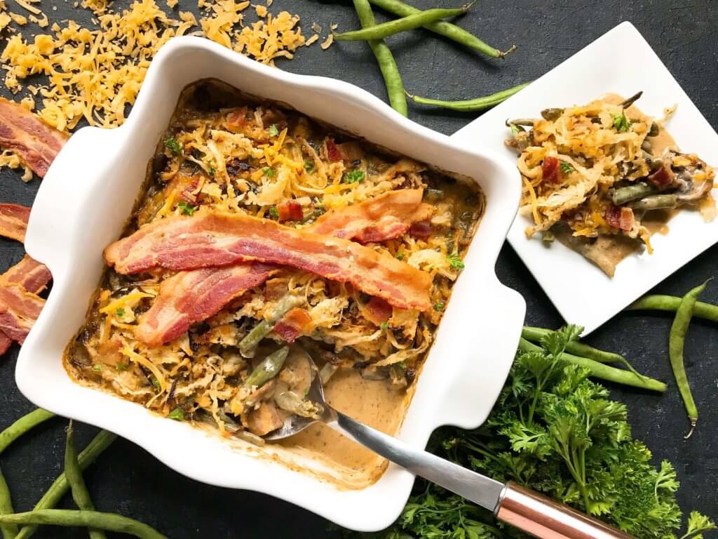 A twist on a classic holiday side dish. Bacon and cheddar cheese enhance a homemade green bean casserole made from scratch. Make in advance for quick assembly on Christmas, Thanksgiving, Easter, or other holiday meals. Bacon Cheddar Green Bean Casserole #thanksgivingrecipes #greenbeancasserole #holidayrecipes #christmasrecipes #baconcheddar