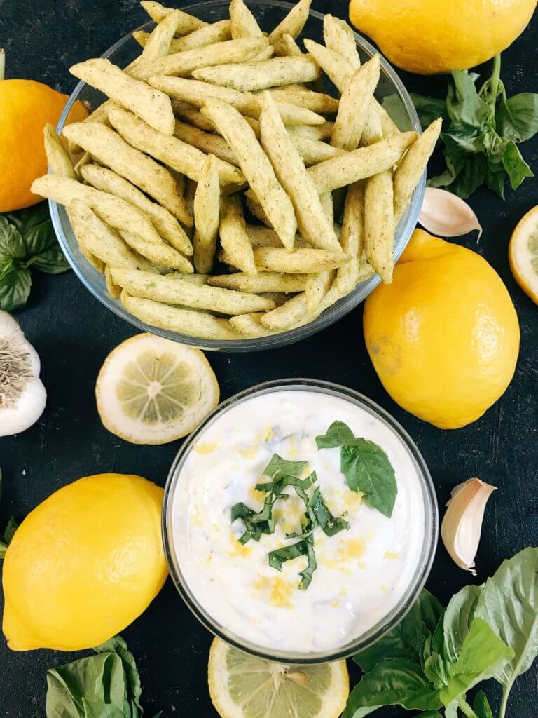 Ready in just minutes, this easy dipping sauce recipe is made with plain Greek yogurt, fresh basil, lemon, and garlic. Dunk your favorite vegetables, chips, or Harvest Snaps! Quick appetizer or snack that is gluten free (gf) and vegetarian. Healthy Lemon Basil Dipping Sauce with Harvest Snaps #appetizerrecipes #glutenfree #vegetarian