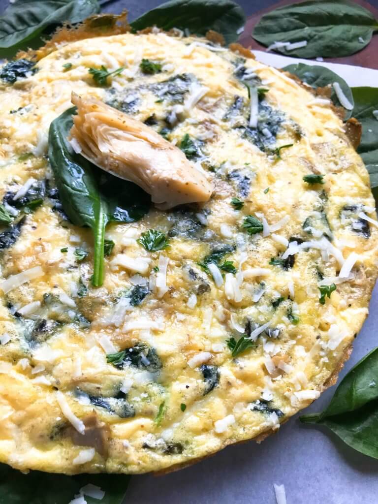 Ready in 20 minutes, this frittata is based off of Spinach Artichoke Dip. Vegetarian, low carb keto, and gluten free (GF) recipe that is simple,. fast, and easy. Great for breakfast or brunch. Spinach, artichoke hearts, and Parmesan cheese. Spinach Artichoke Frittata #breakfastrecipes #brunch #glutenfreerecipes