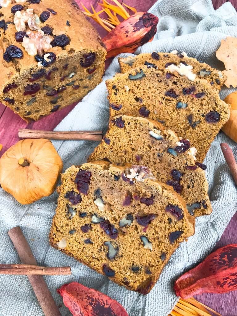 Perfect for fall and Thanksgiving, this Cranberry Walnut Pumpkin Spice Bread recipe is full of fall flavors in comfort food. Simple to make and vegetarian, great for breakfast, dessert, or a snack. #pumpkinbread #pumpkinspice #bread