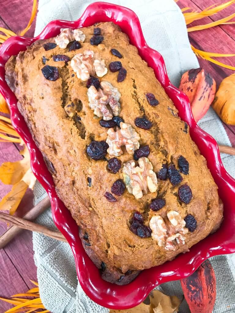 Perfect for fall and Thanksgiving, this Cranberry Walnut Pumpkin Spice Bread recipe is full of fall flavors in comfort food. Simple to make and vegetarian, great for breakfast, dessert, or a snack. #pumpkinbread #pumpkinspice #bread