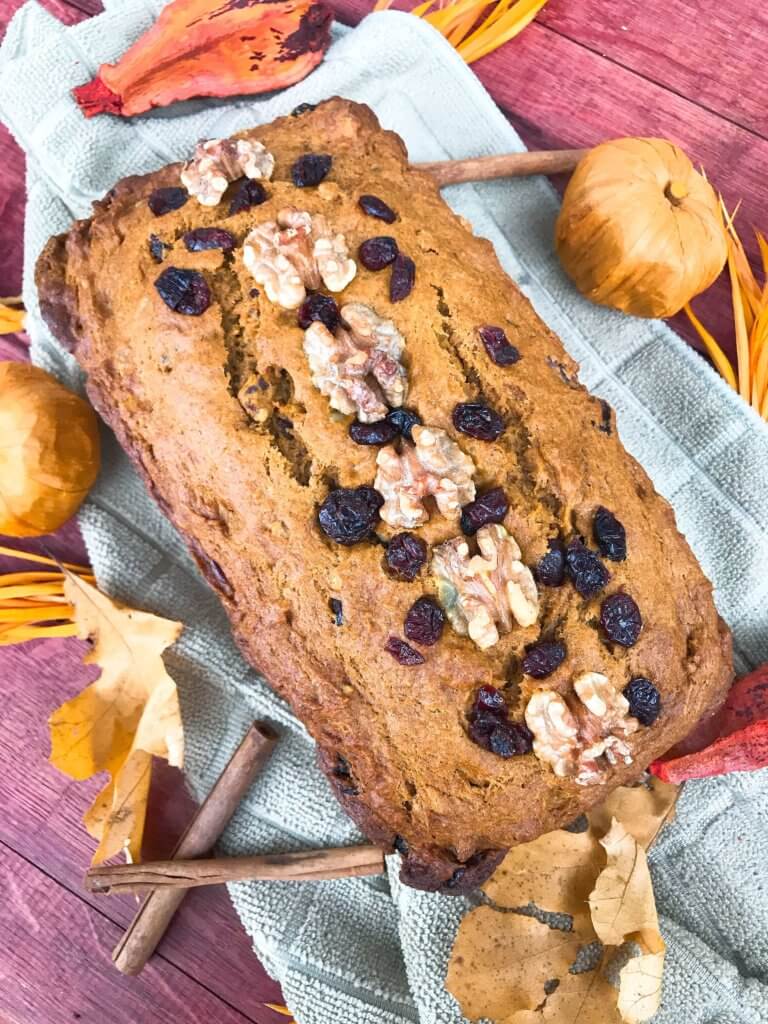 Perfect for fall and Thanksgiving, this Cranberry Walnut Pumpkin Spice Bread recipe is full of fall flavors in comfort food. Simple to make and vegetarian, great for breakfast, dessert, or a snack. #pumpkinbread #pumpkinspice #bread