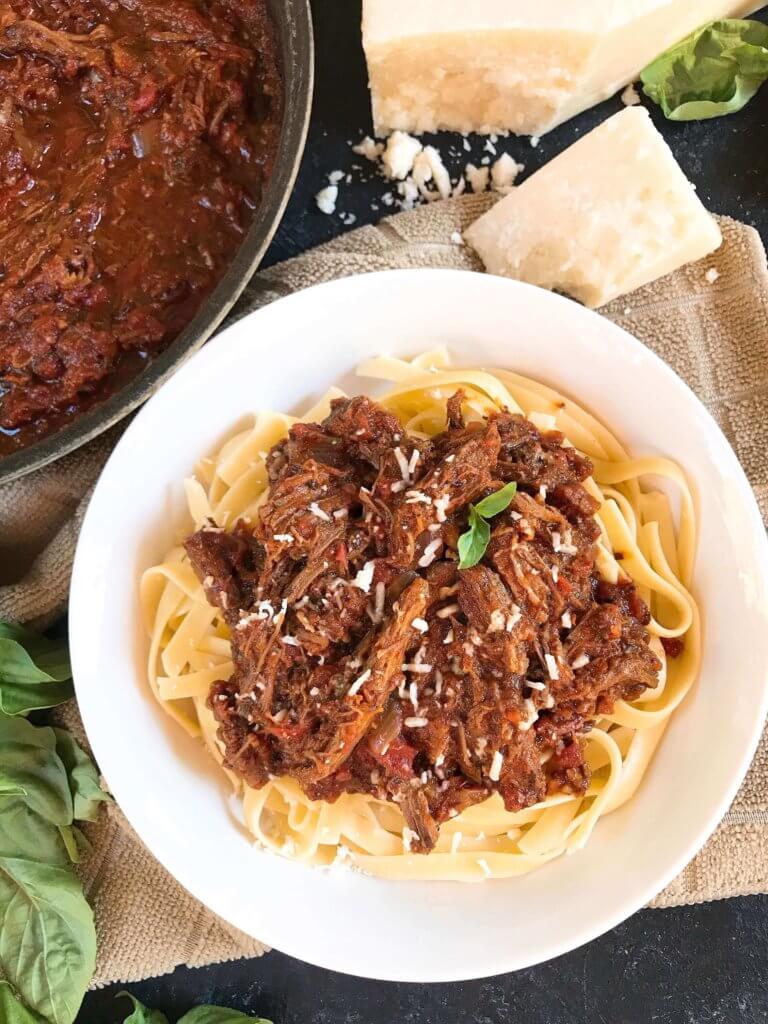 Slow Cooker Italian Shredded Beef Ragu Sauce recipe takes just 5 minutes to put together for a quick and simple comfort food dinner! Serve over pasta for an easy meal. Gluten free (gf), great for cold weather. #slowcooker #crockpot #italianrecipe