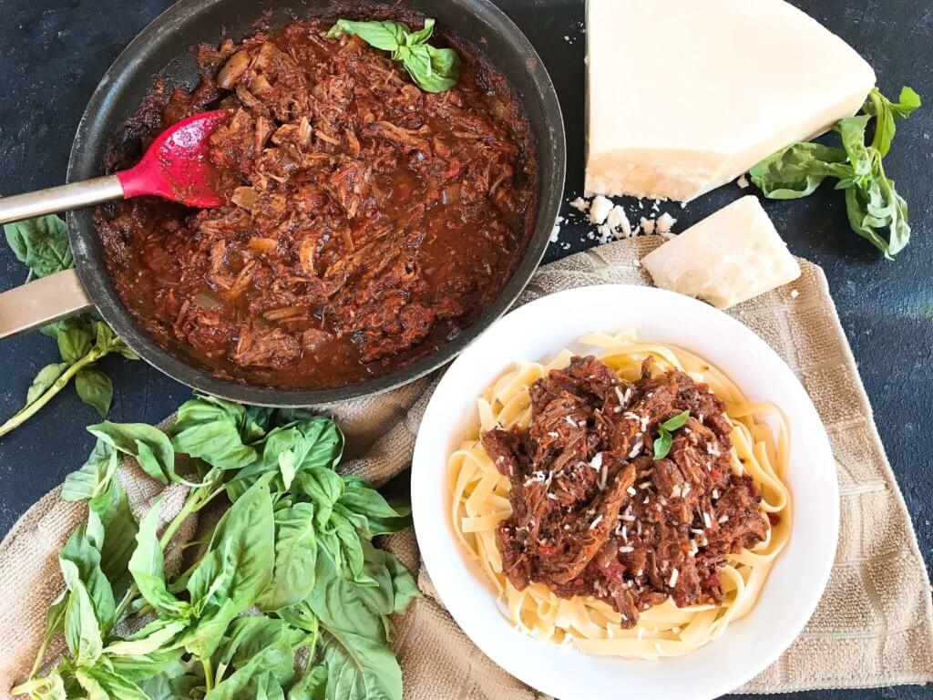 Slow Cooker Italian Shredded Beef Ragu Sauce recipe takes just 5 minutes to put together for a quick and simple comfort food dinner! Serve over pasta for an easy meal. Gluten free (gf), great for cold weather. #slowcooker #crockpot #italianrecipe