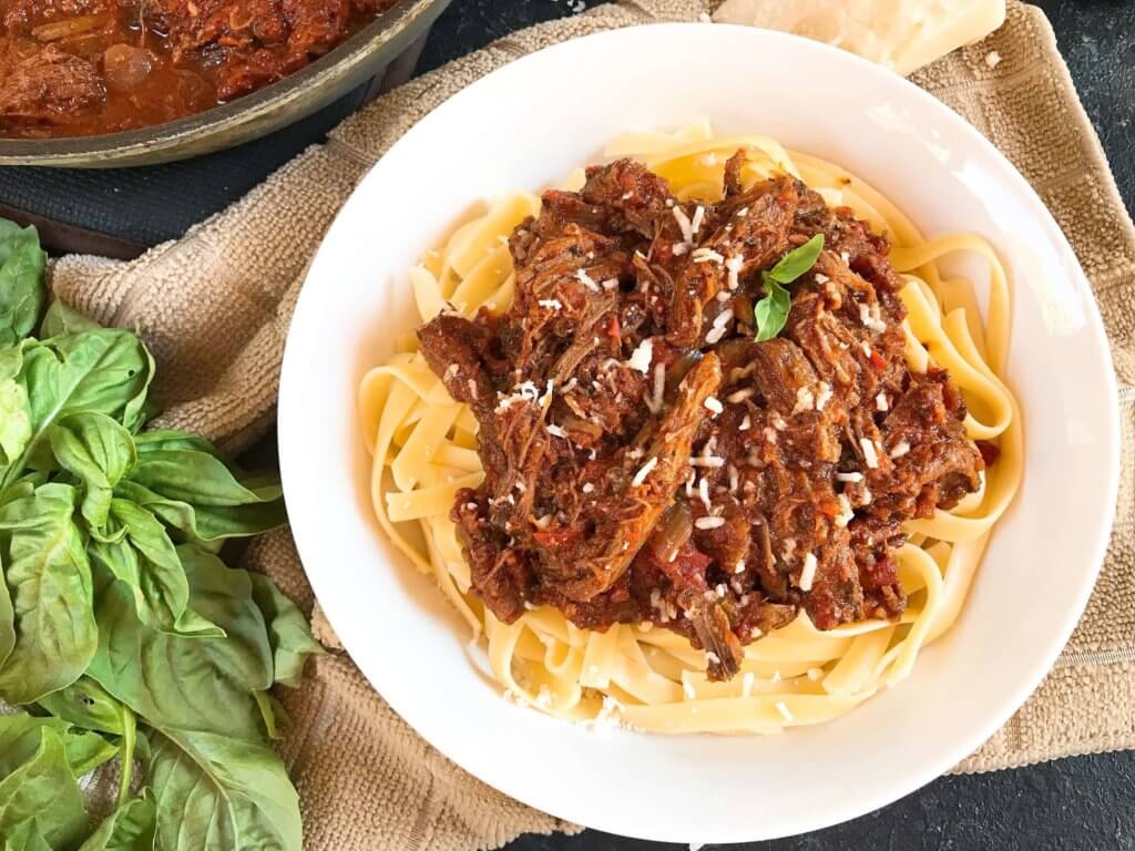 Slow Cooker Italian Shredded Beef Ragu Sauce recipe takes just 5 minutes to put together for a quick and simple comfort food dinner! Serve over pasta for an easy meal. Gluten free (gf), great for cold weather. #slowcooker #crockpot #italianrecipe